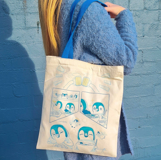 wearing Eating Penguins Tote Bag with double sided print