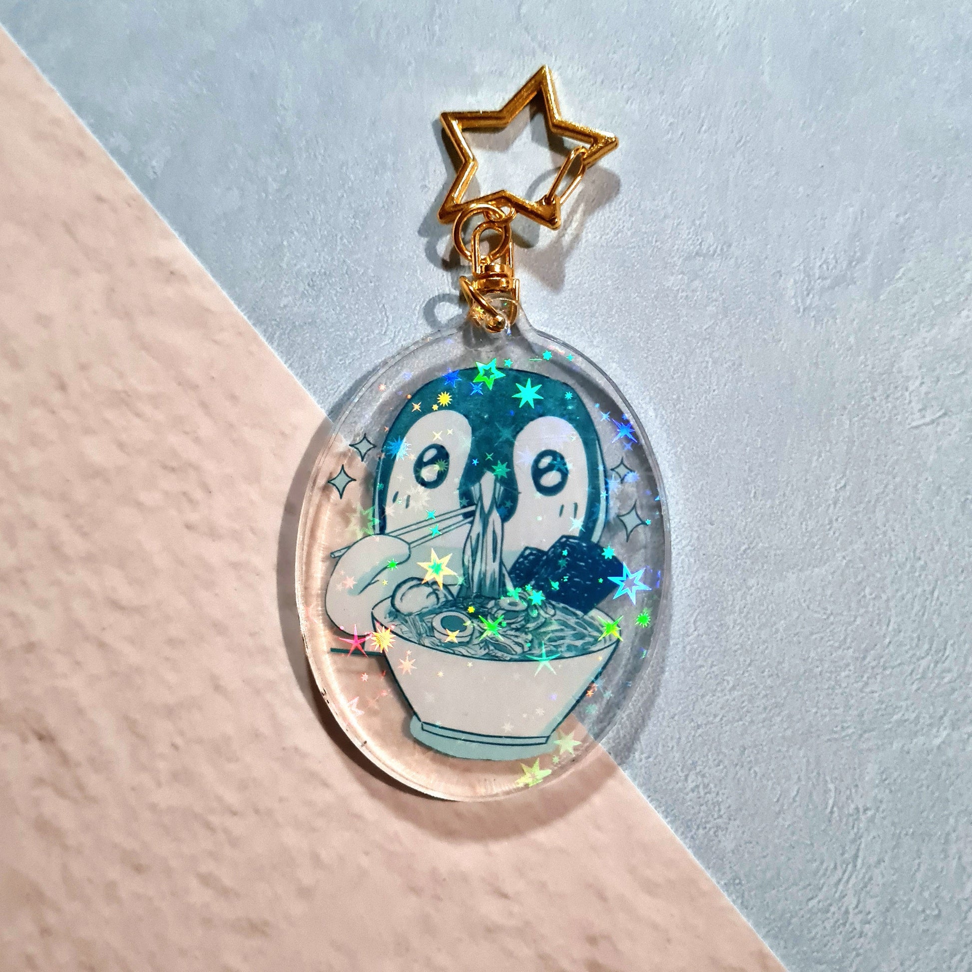 Backside of Eating Ramen Penguin Acrylic Keychain